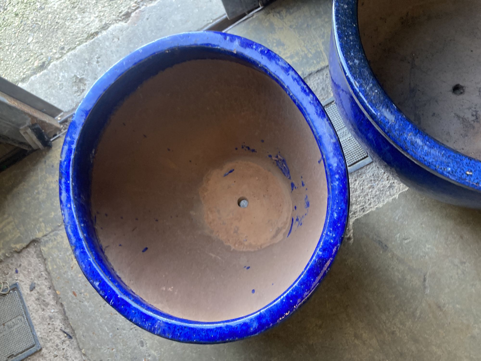 Two circular blue glazed garden planters, larger 50cm diameter, 30cm high